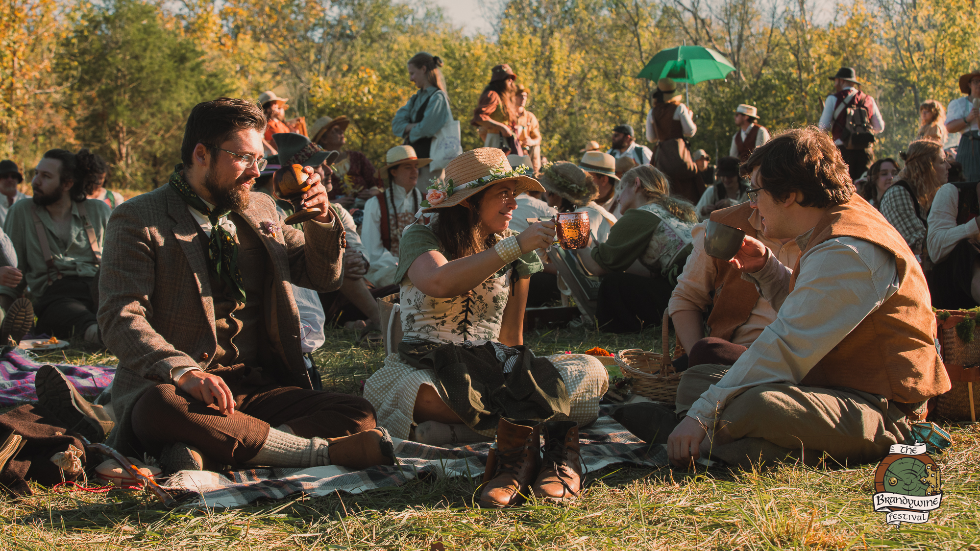 Guests sharing food and drink at the festival market