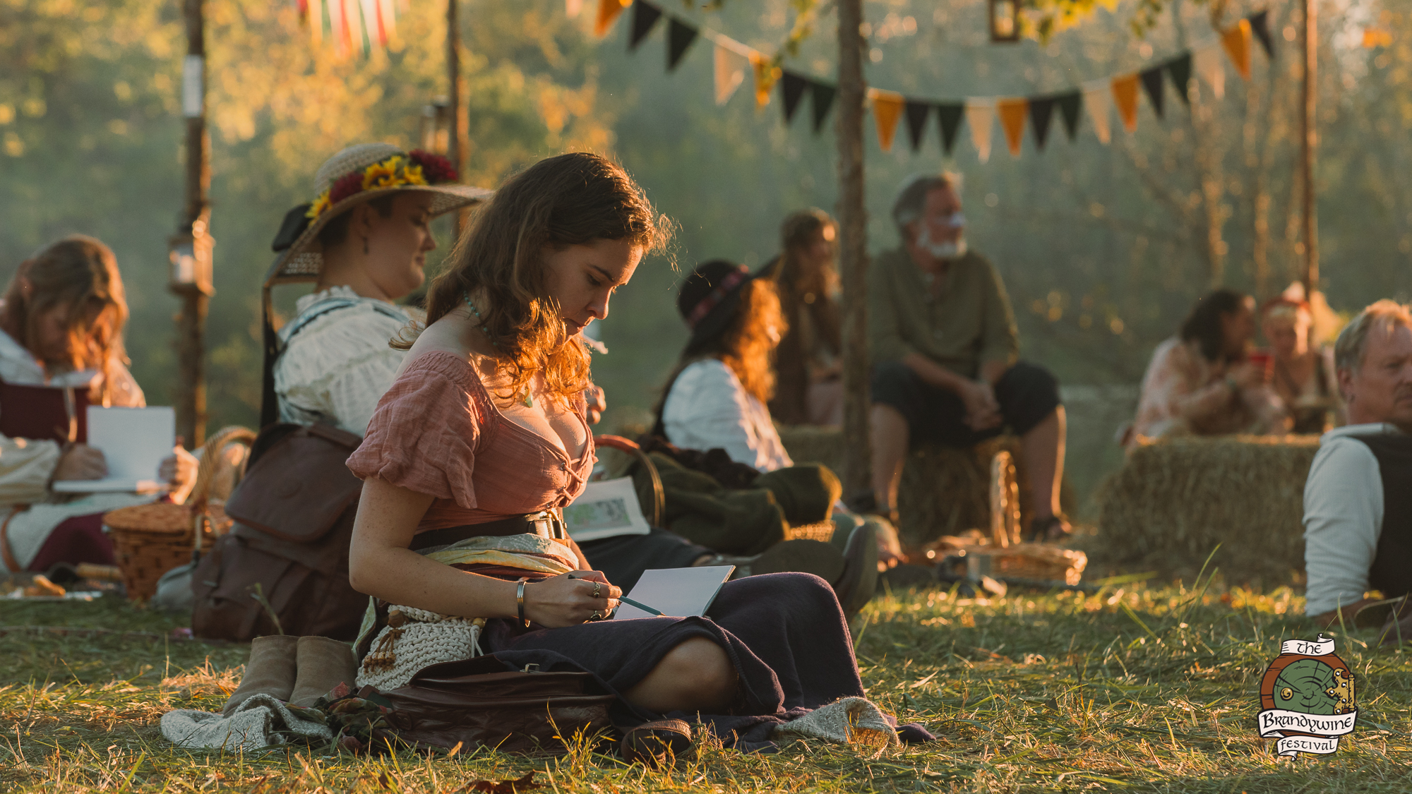 A maker demonstrating a traditional craft on the meadow